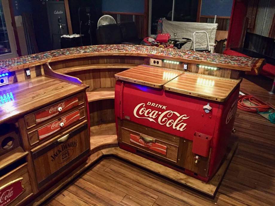 Custom built bar repurposed out of old Coca Cola coolers and whiskey barrels